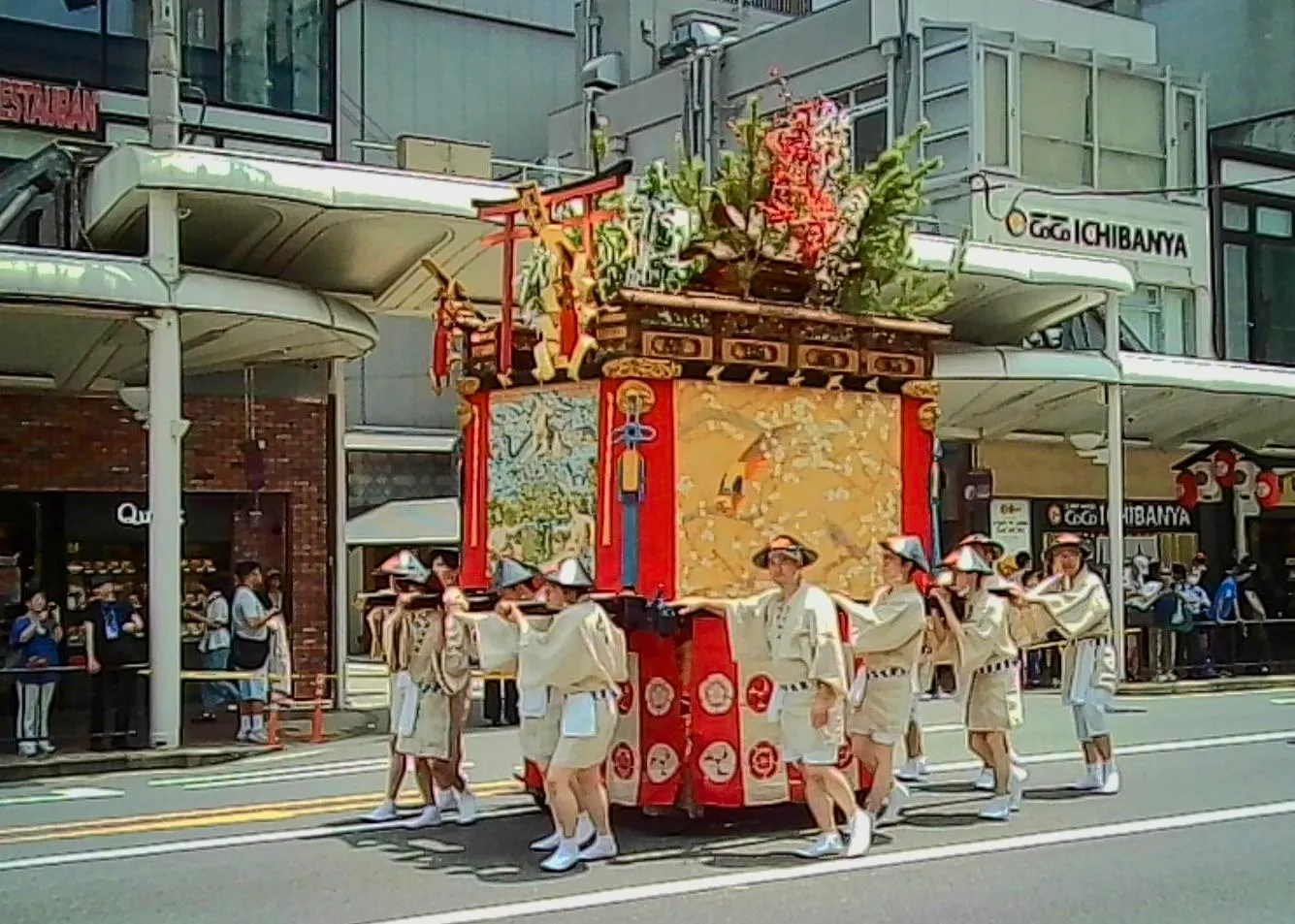 A festival float carried through the street, Gion Festival