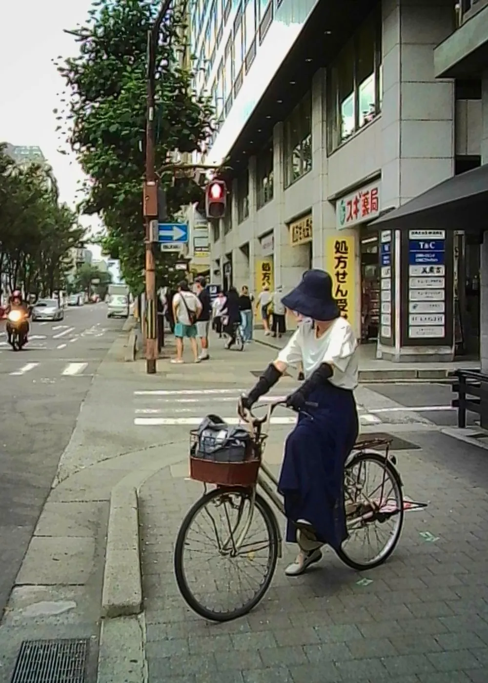 Cyclist waiting at a crossing, Kyoto