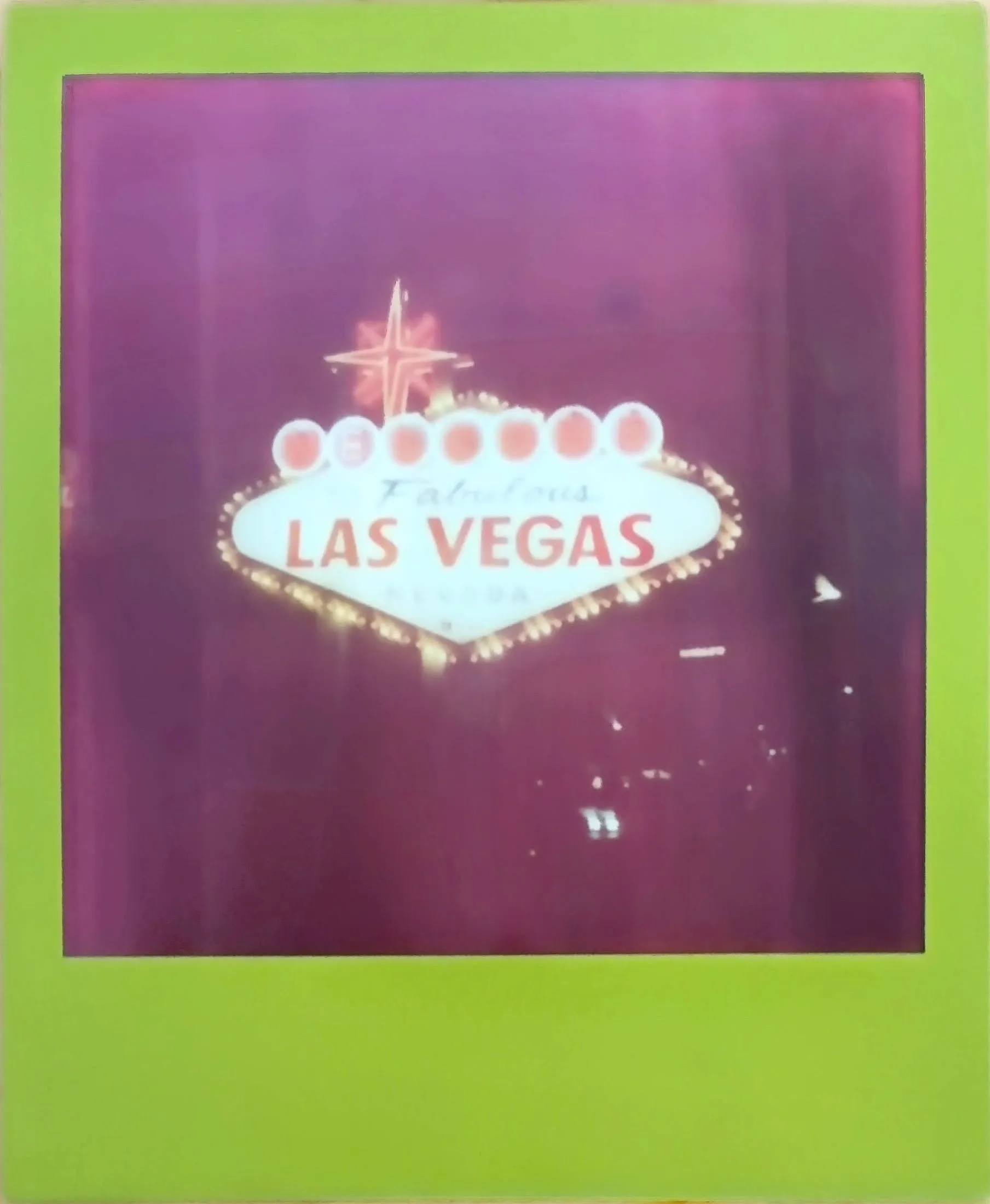 The Welcome to Fabulous Las Vegas sign at night, the whole print washed magenta, in a lime green frame
